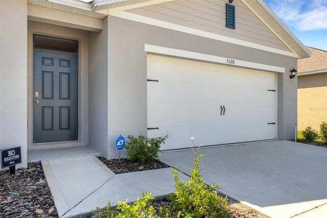 exterior space with concrete driveway