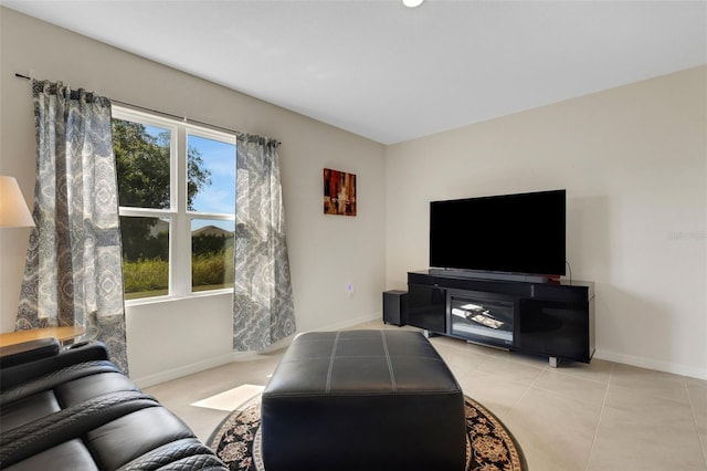 living room with light tile patterned floors and baseboards