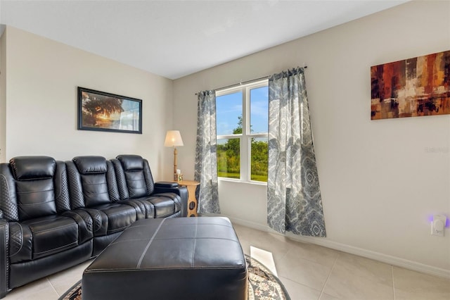 living room featuring light tile patterned flooring and baseboards