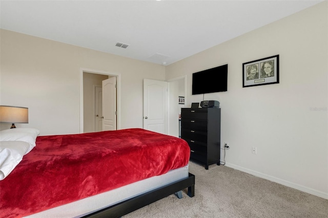 bedroom featuring baseboards, visible vents, and light colored carpet