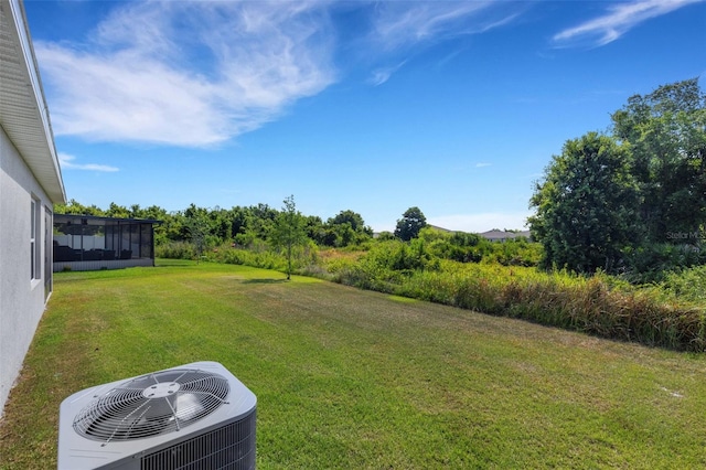 view of yard with central AC