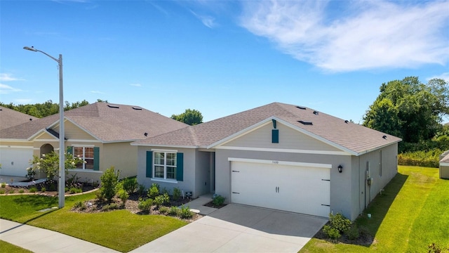 ranch-style house featuring a garage, driveway, a shingled roof, a front yard, and stucco siding