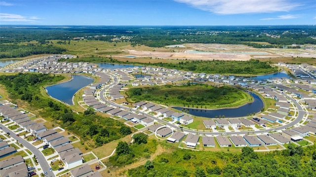 bird's eye view featuring a water view and a residential view