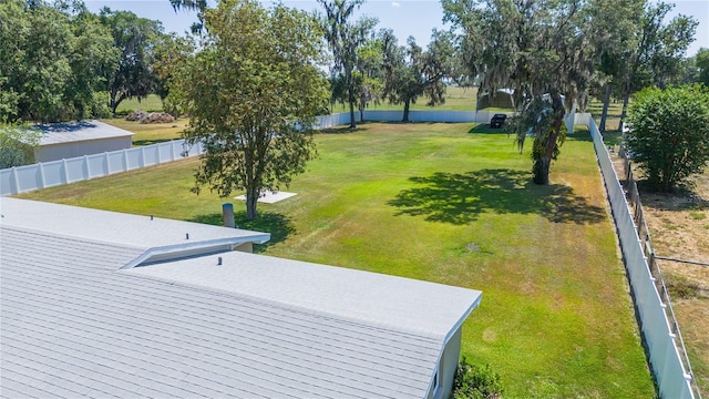 view of community featuring a yard