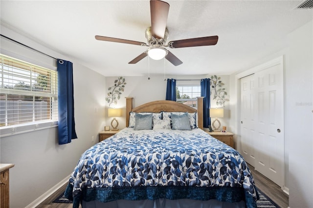 bedroom featuring wood-type flooring, a closet, and ceiling fan