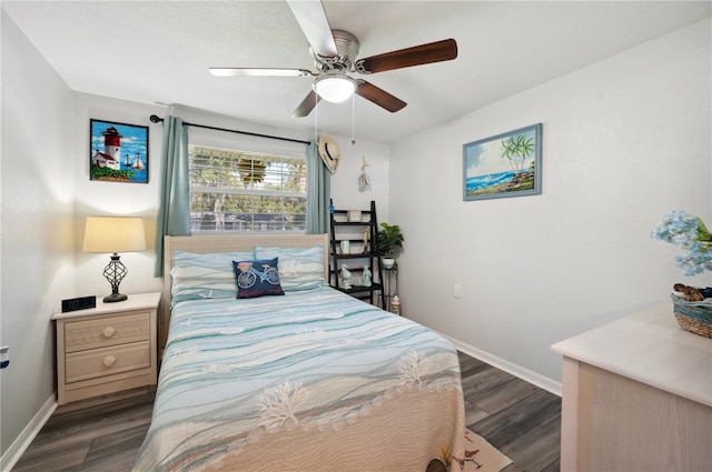 bedroom with dark hardwood / wood-style floors and ceiling fan