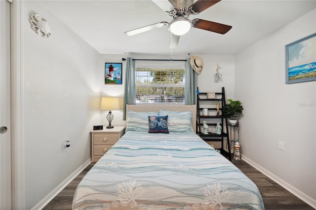 bedroom with ceiling fan and dark wood-type flooring