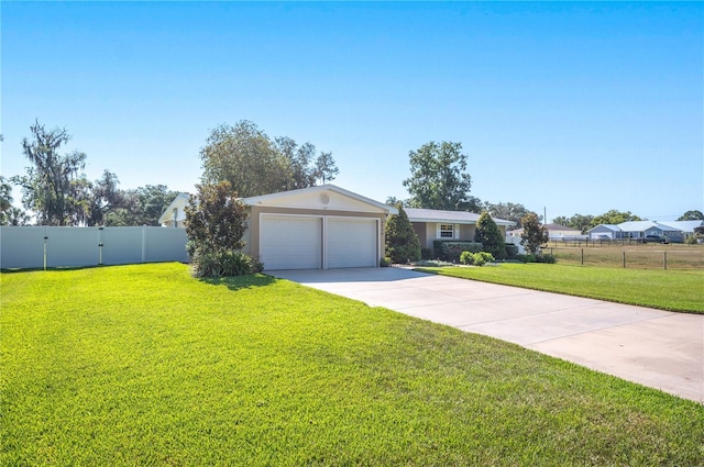 ranch-style home featuring a front lawn and a garage