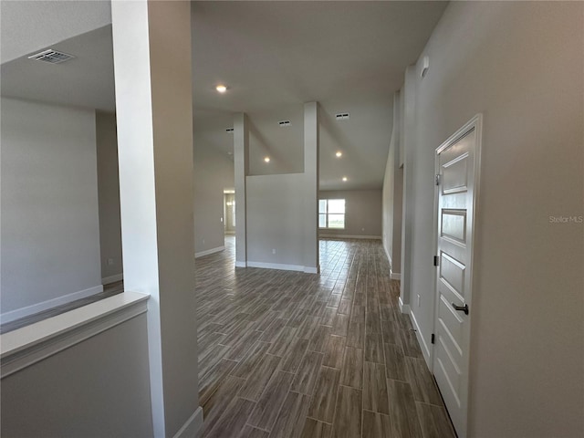 corridor featuring dark hardwood / wood-style floors