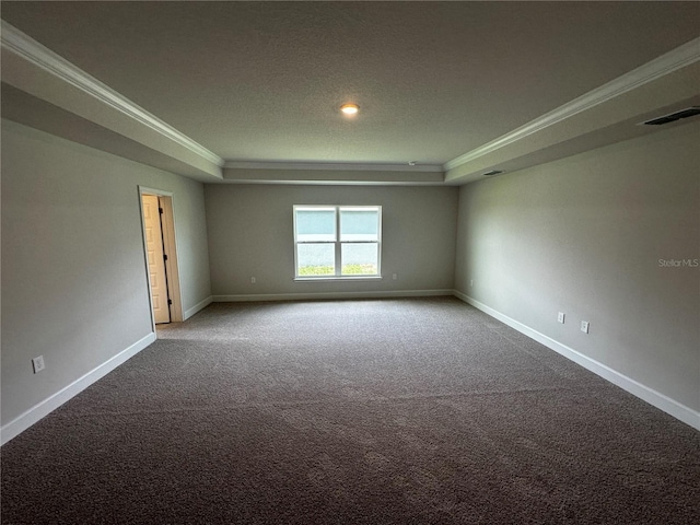 unfurnished room with carpet, a raised ceiling, and crown molding