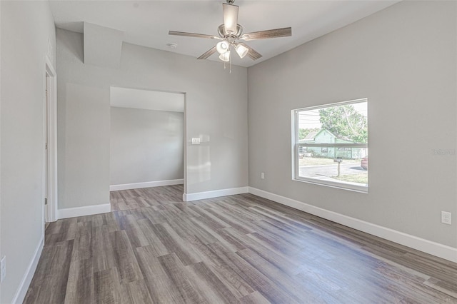 spare room with light hardwood / wood-style floors and ceiling fan