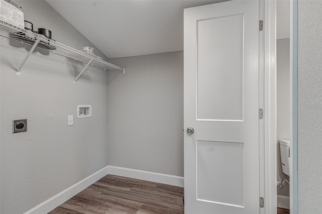 washroom featuring hookup for an electric dryer, hookup for a washing machine, and hardwood / wood-style flooring