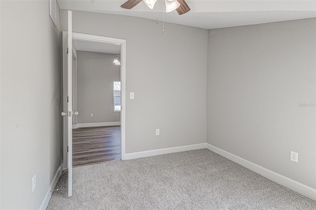 unfurnished room with carpet flooring and ceiling fan