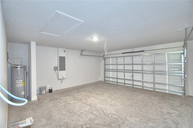 garage featuring electric panel and water heater