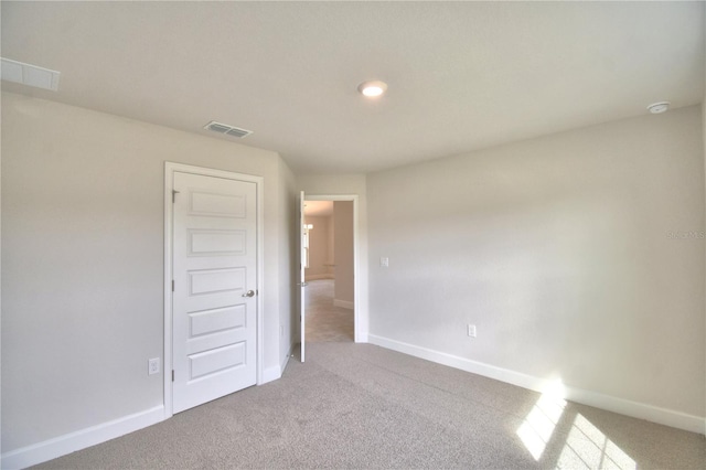 view of carpeted spare room