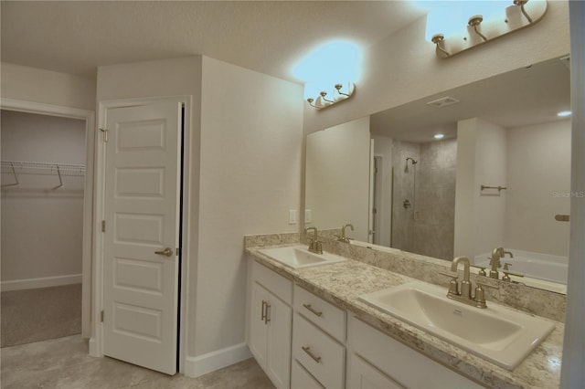 bathroom featuring vanity, tile patterned floors, and an enclosed shower