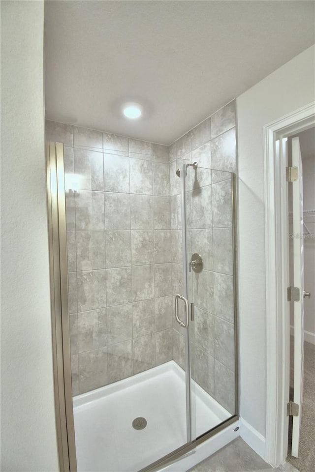 bathroom featuring an enclosed shower