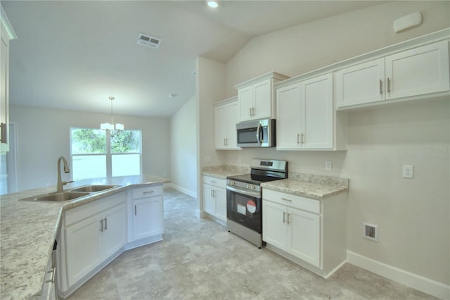 kitchen with stainless steel appliances, sink, decorative light fixtures, a chandelier, and white cabinetry