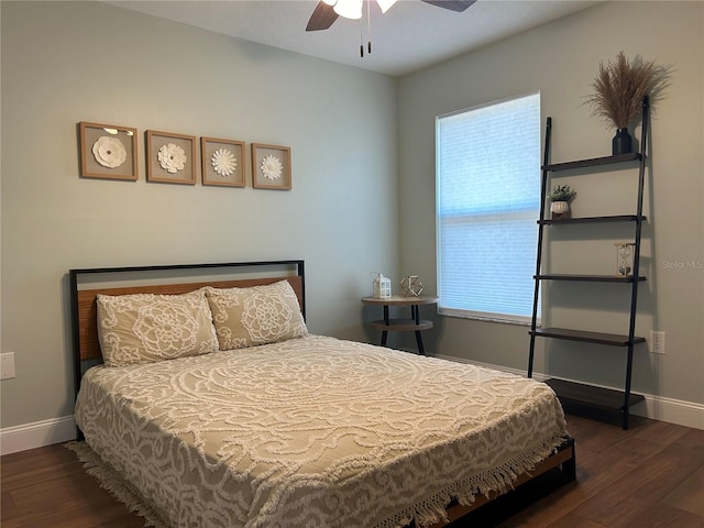 bedroom featuring ceiling fan and dark hardwood / wood-style flooring