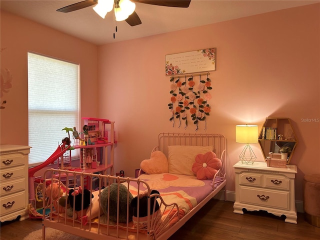 bedroom featuring dark hardwood / wood-style floors and ceiling fan