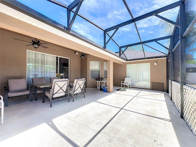 view of patio / terrace featuring ceiling fan and a lanai