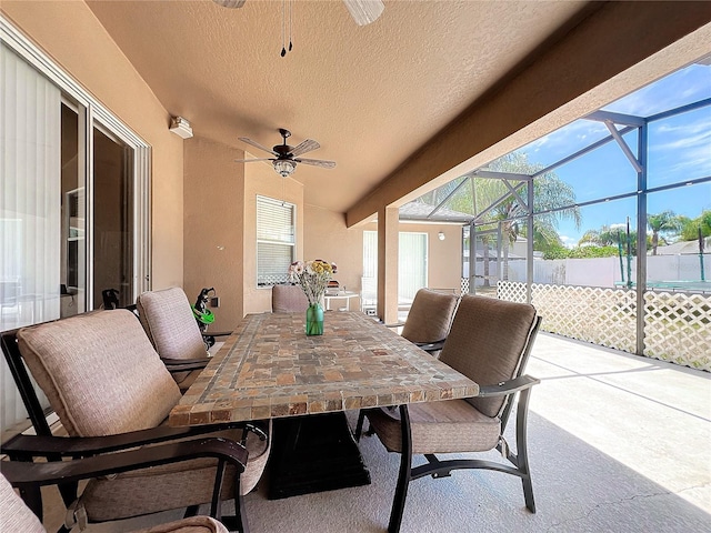 view of patio / terrace with glass enclosure and ceiling fan