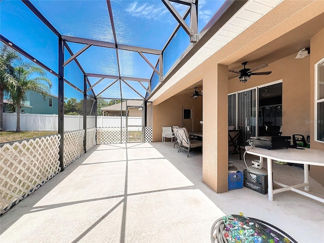 view of patio with a lanai and ceiling fan