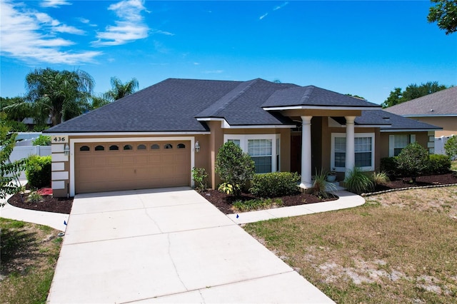 view of front of property featuring a garage