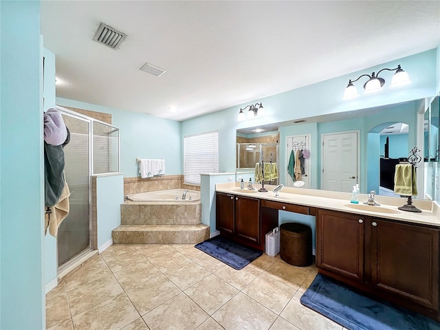 bathroom featuring separate shower and tub, tile patterned floors, and vanity