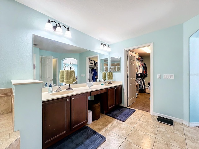 bathroom with vanity and tile patterned floors