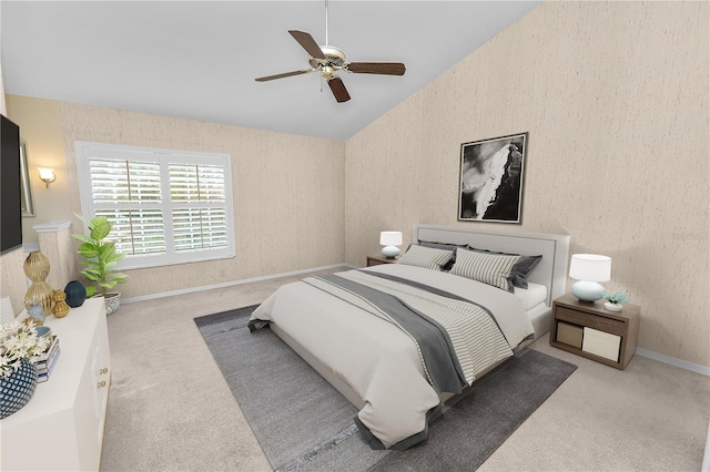 bedroom featuring ceiling fan, vaulted ceiling, and light carpet