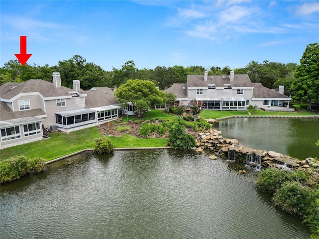 birds eye view of property featuring a water view