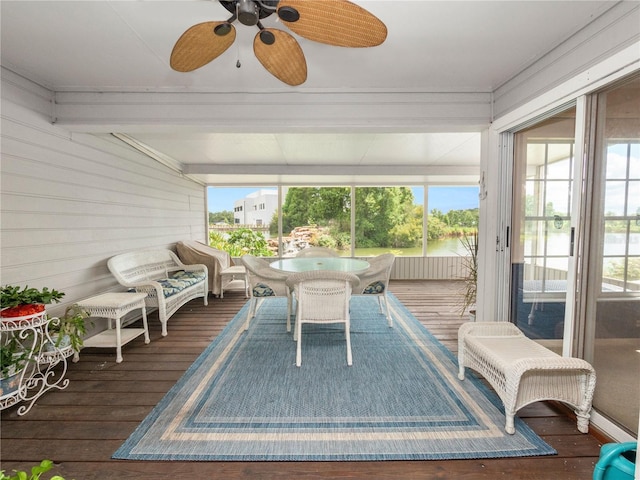 sunroom / solarium featuring a wealth of natural light and ceiling fan