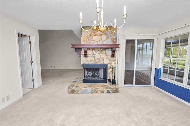 unfurnished living room with a stone fireplace, carpet floors, and a chandelier