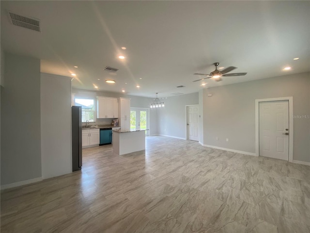 unfurnished living room with ceiling fan, light wood-type flooring, sink, and french doors