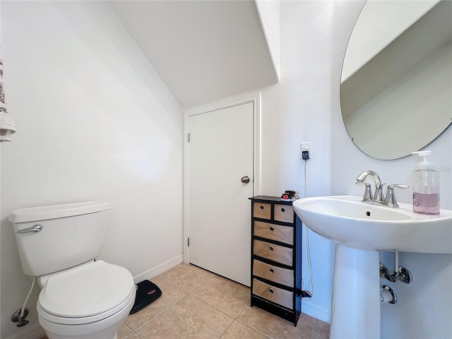 bathroom featuring tile patterned floors and toilet