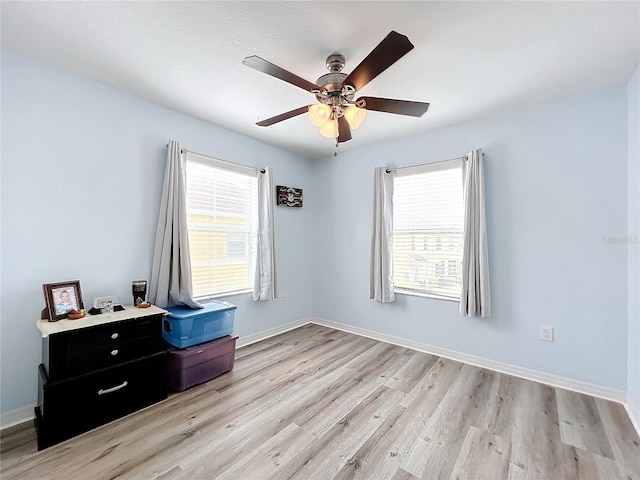 interior space with ceiling fan and light wood-type flooring