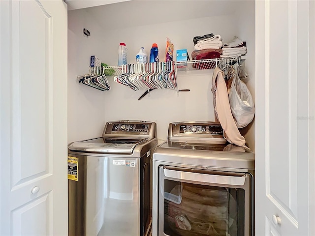 laundry area with washing machine and clothes dryer