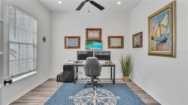 office area with wood-type flooring and ceiling fan