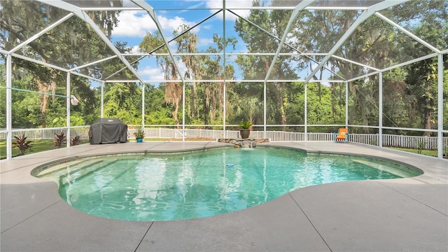 view of pool featuring a patio and a grill