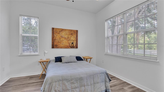 bedroom with hardwood / wood-style floors