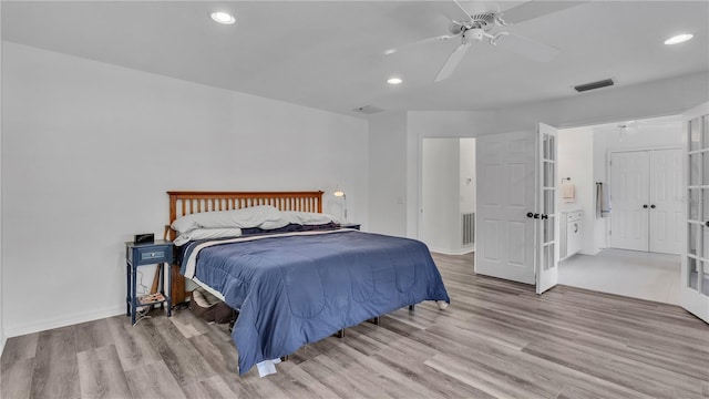 bedroom with light wood-type flooring and ceiling fan