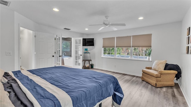 bedroom with ceiling fan and wood-type flooring