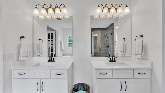 bathroom featuring vanity and a shower with shower door