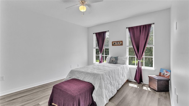 bedroom featuring wood-type flooring and ceiling fan