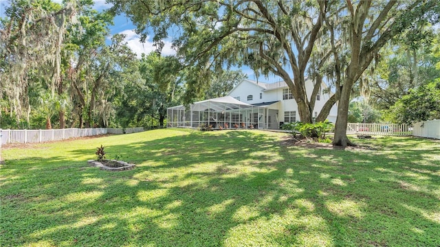 view of yard with a lanai