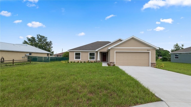 single story home with a garage and a front yard