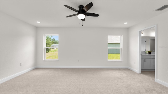 carpeted empty room with ceiling fan