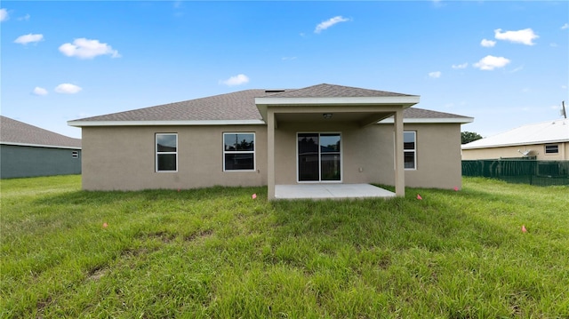 back of property featuring a patio area, a yard, and central AC