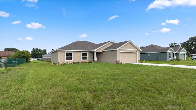 ranch-style house featuring a front yard and a garage